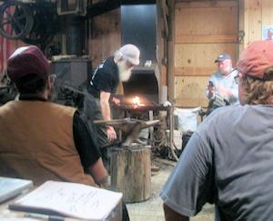 Tom Latane at the forge for the coffee mill class